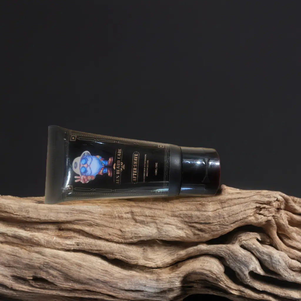 Tube of aftershave on a wooden surface with a dark background