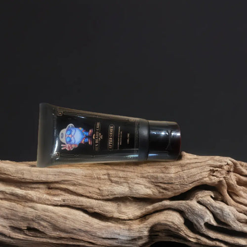 Tube of aftershave on a wooden surface with a dark background