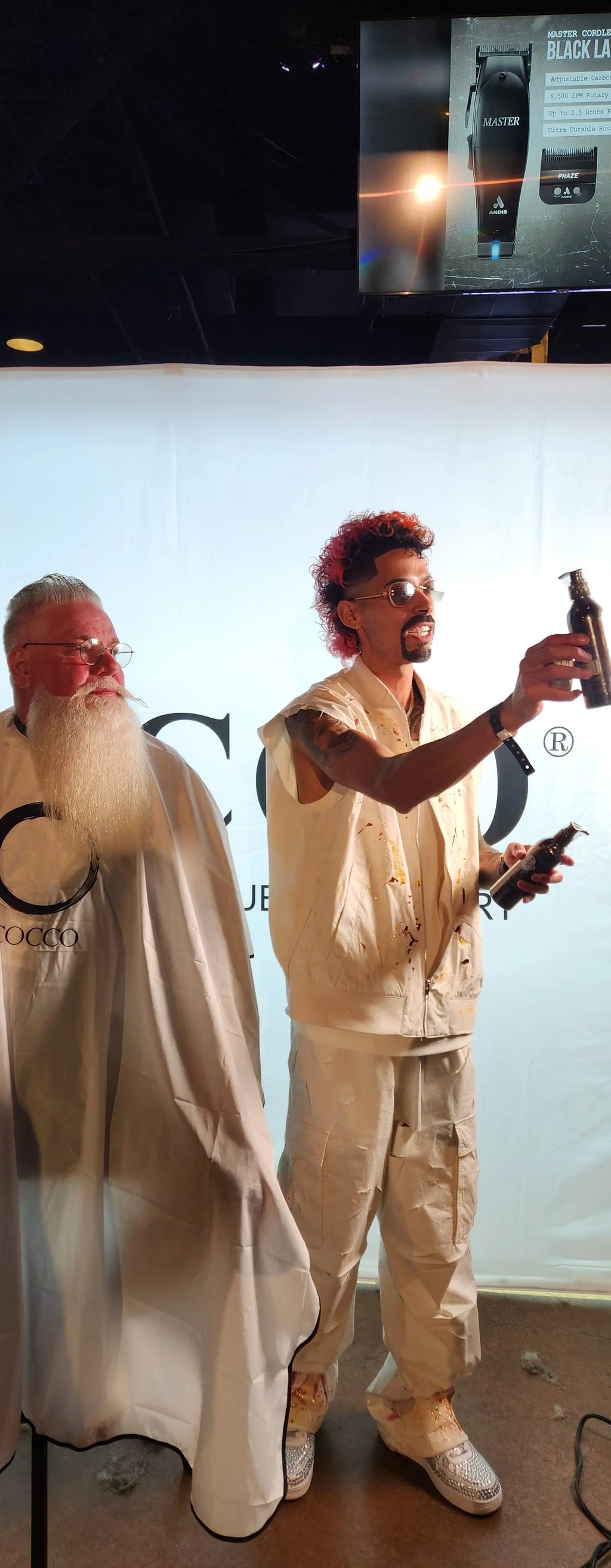 Person in beige outfit with red hair on a white background